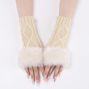 Detail of beige knit arm warmer with white faux fur trim and diamond pattern