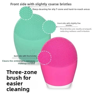 Detailed view of the three-zone silicone facial cleanser brush head in green and pink
