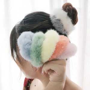 Plush faux fur scrunchies in multiple pastel colors for elegant women ponytail styling