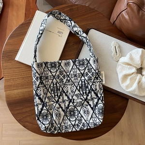 Vintage embroidered canvas tote bag with floral patterns and bird motifs for casual use