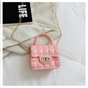 Detailed view of pink quilted PVC jelly bag with gold chain strap and metal turn lock clasp