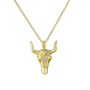 Close-up of 18K gold plated bull head pendant necklace with sparkling crystal inlay