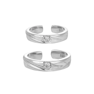 Polished S925 sterling silver couple rings with textured finish and zircon stones
