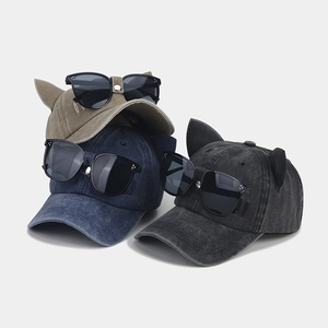 Detailed view of cat ear baseball caps with aviator sunglasses in three vintage colors