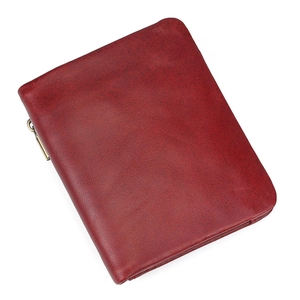 Detail view of red leather wallet with metallic zipper and premium stitching quality