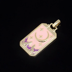 Detail of gold-plated tarot The Moon pendant with pink and purple enamel and roman numeral XVIII