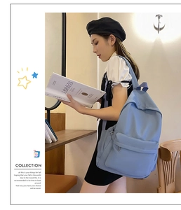 Close-up of a sky blue minimalist backpack showing durable fabric and front zipper pocket