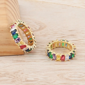 Detailed close-up of bohemian rainbow zircon eternity ring with gold-plated setting