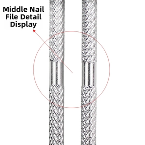 Macro detail of stainless steel nail pusher with non-slip diamond texture and smooth grip