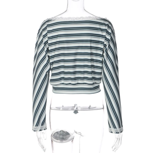 Macro shot of the back view showing striped crop top with delicate white lace trim details