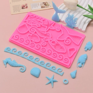 Pink silicone marine life mold featuring seahorse, starfish and coral for DIY cake decor