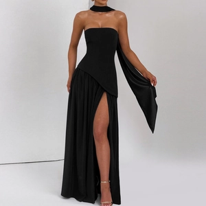 Detail of elegant black strapless evening gown featuring a high side slit and matching neck scarf
