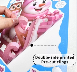 Double-sided pre-cut Christmas window clings with pink snowman and owl motifs