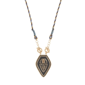 Detail of vintage black Hamsa tarot pendant with golden sunrays on woven cord necklace