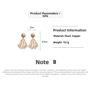 Detail of 18K gold-plated pleated mesh earrings featuring irregular white pearls and brass