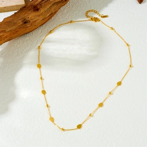 Gold-plated stainless steel necklace with delicate heart and star pendants on white background