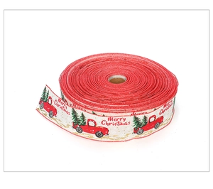 Close-up of Christmas ribbon featuring red truck, green tree, and Merry Christmas text