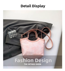 Close-up of pink jacquard fabric handbag with abstract textures and silver hardware details