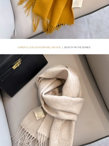 Detailed view of ginger and off-white scarves made from 100% premium Australian wool