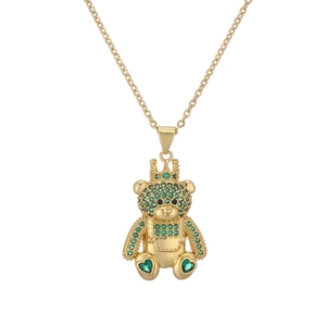 Gold teddy bear necklace with green rhinestones and heart feet on a fine chain