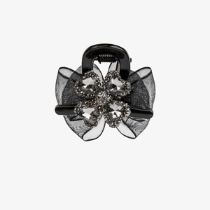 Elegant black hair claw clip featuring a crystal four-leaf clover and mesh ribbon bow