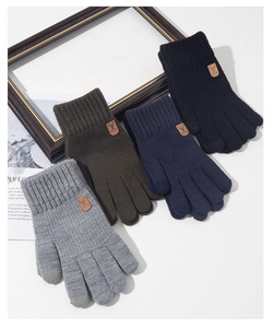 Detailed knit gloves with touchscreen tips and embossed leather patch in multiple colors