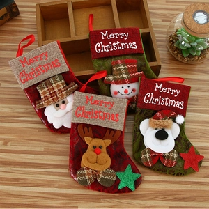 Set of 4 vintage faux leather Christmas stockings featuring Santa, Snowman and Reindeer