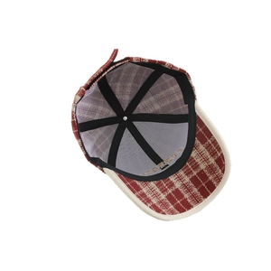 Retro red plaid wool baseball cap with embroidered lettering and cream-colored brim