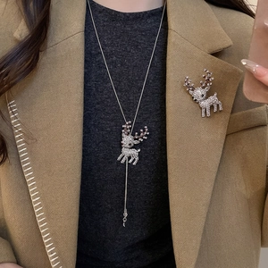 Elegant Christmas reindeer jewelry set with necklace and brooch in silver finish