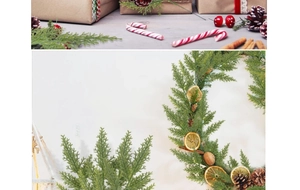 Close-up of artificial pine wreath with dried orange slices, pine cones and cinnamon sticks