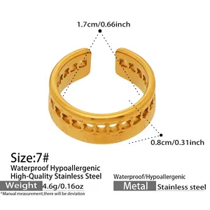 Detailed view of gold C-shaped stainless steel ring with Roman numerals engraving