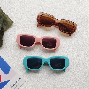 Three pairs of vintage square kids sunglasses with UV400 protection in brown pink and teal