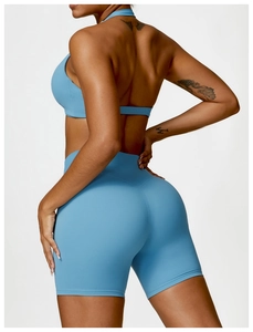 Detail of sky blue sports bra with racerback and high-waist biker shorts set