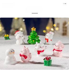 Miniature Christmas resin figurine set featuring a snowman, pig, and rabbit in the snow