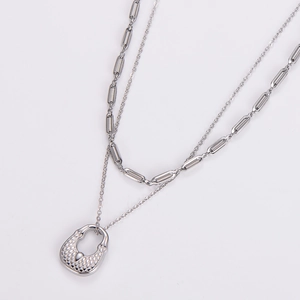 Silver double layer necklace with woven horseshoe pendant and minimalist link chain