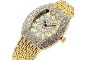 Close-up view of luxury gold tonneau watch featuring full rhinestone inlay and Roman dial