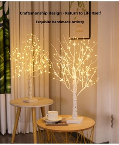 Detail of warm LED lights on white birch tree decoration with natural wood texture