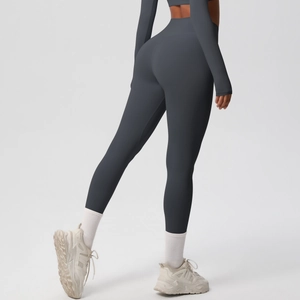 Detailed back view of dark gray high-waisted seamless compression yoga leggings and top
