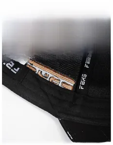 Macro detail of breathable widened sweatband with FBX logo on black baseball cap