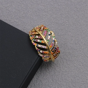 Detailed macro view of feather ring with vibrant multi-color pavé cubic zirconia stones