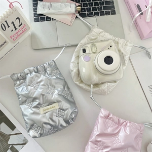 Quilted bow drawstring storage bag for Instax mini camera in glossy pastel colors