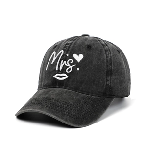 Detailed embroidery of Mrs. with heart and lip icons on washed black vintage baseball cap