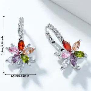 Macro shot of silver lotus earrings with colorful marquise-cut stones and dimensions