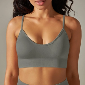 Detail of seamless ribbed texture and deep V-neckline on this olive grey sports bra