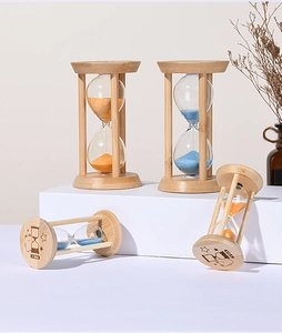 Detail of wooden sand timers with 1 and 3 minute marks and cute bear engravings