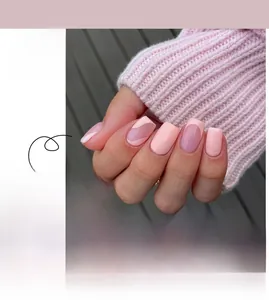 Detail view of pink French-style press-on nails with wave patterns and square shape