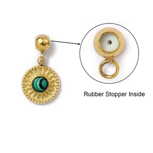Detail of gold pendant with green stone and built-in rubber stopper for jewelry DIY