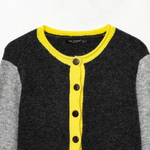 Three-color contrast knit cardigan with black body, grey sleeves and yellow trim