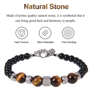 Detail of natural tiger eye and obsidian beads with stainless steel lobster clasp