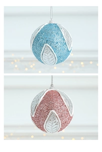 Detail of 8cm glitter Christmas balls with leaf relief in blue and pink finish